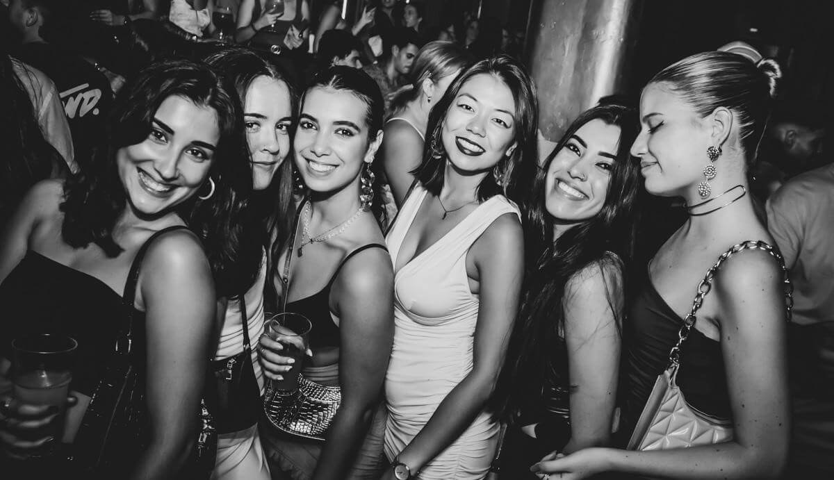 Group of friends posing for a photo during a night out in Valencia.